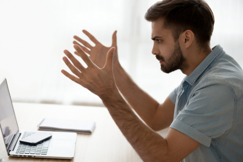 Man frustrated with laptop